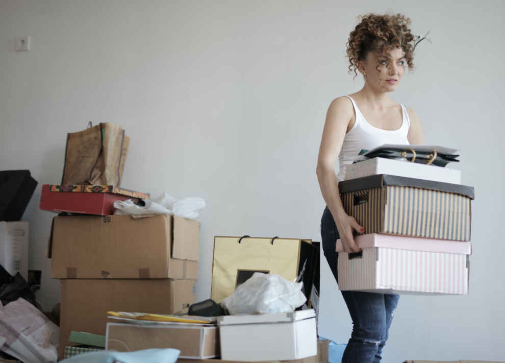 A student packing belongings